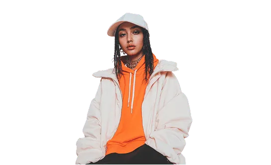Person in a cream jacket and cap over an orange hoodie